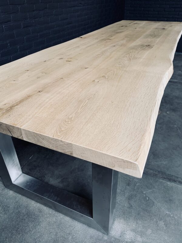 Unique heavy oak table with stainless steel base.