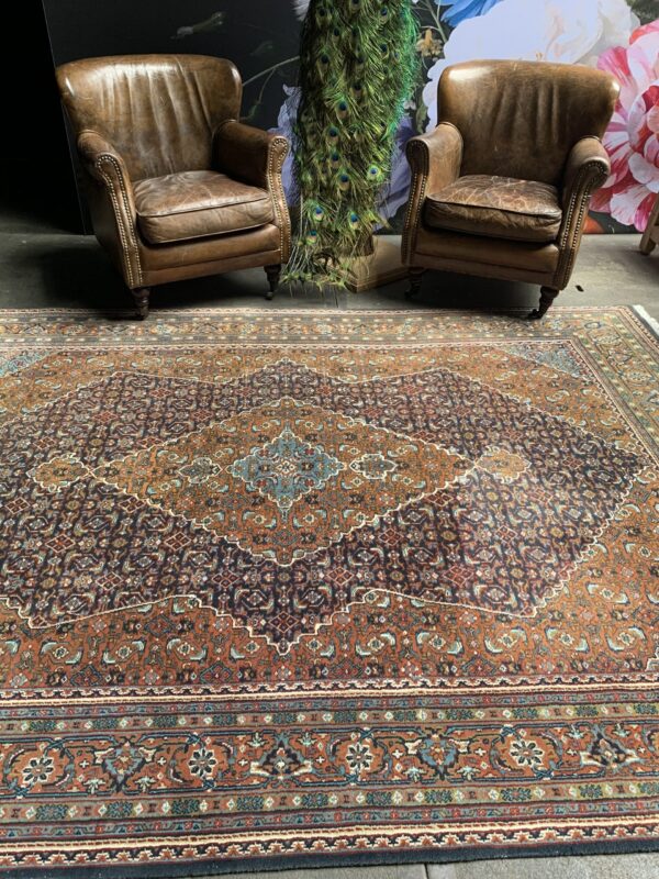 Hand-knotted vintage woolen Bidjar Persian carpet.