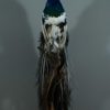 Stuffed peacock mounted on a pedestal. Fresh taxidermy.