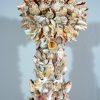 Candlestick made of shells.