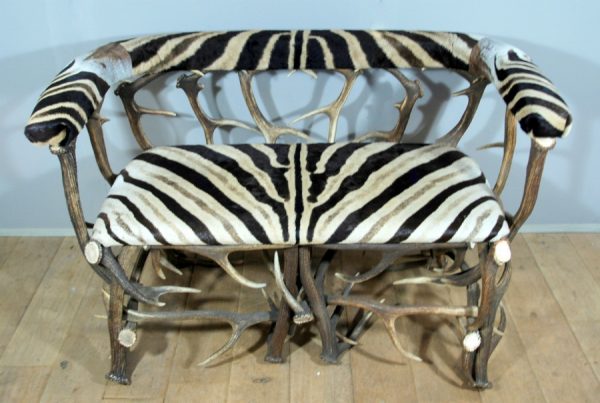 Unique bench made from deer antlers and zebraskin.