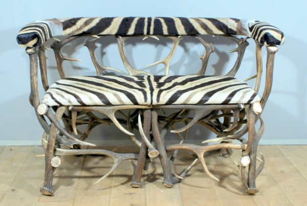 Unique bench made from deer antlers and zebraskin.