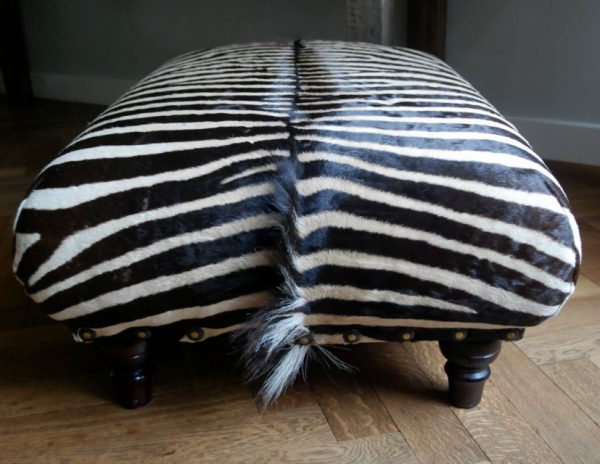 Very nice and unique zebra ottoman.