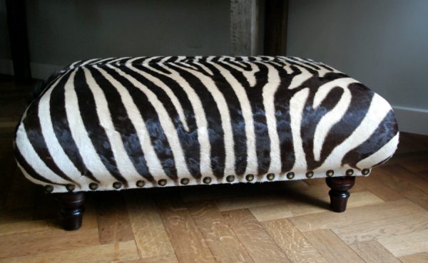 Very nice and unique zebra ottoman.