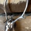 Red deer antlers covered with silver gray paint.