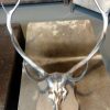 Red deer antlers covered with silver gray paint.