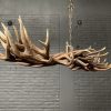 Elongated antler lamp made of red deer antlers