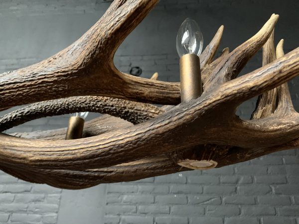 Elongated antler lamp made of red deer antlers