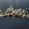 Elongated antler lamp of red deer antlers