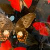 Antique bell jar filled with a mix of black / red butterflies