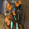 Antique oval bell jar filled with colorful butterflies