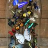 Oval antique glass dome  with colorful mix of many butterfly species