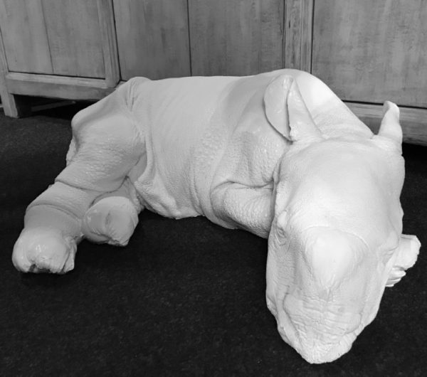 Lifelike replica of a rhinoceros calf