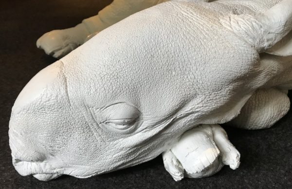 Lifelike replica of a rhinoceros calf