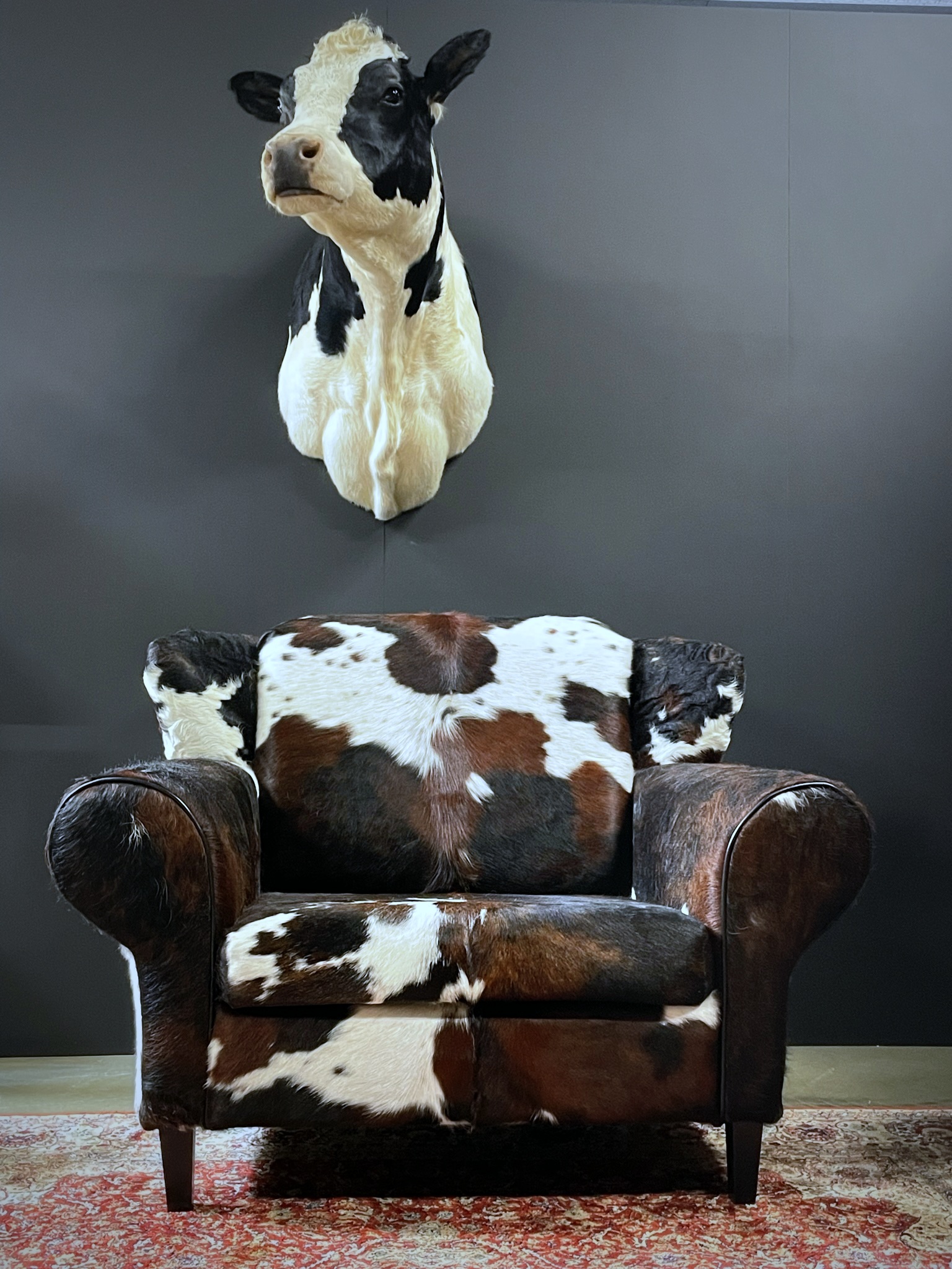 Cowhide loveseat BEAST Interiors