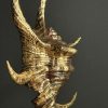 Gouden schelp op marmeren sokkel Gouden schelp op marmeren sokkel