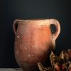 Antieke oker rode terracotta kruik